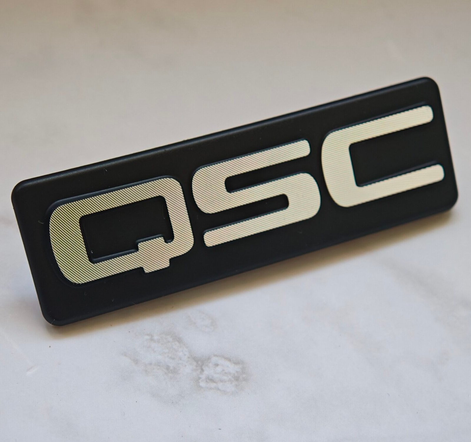 Custom diamond cut aluminum nameplate with 3D metal logo finish