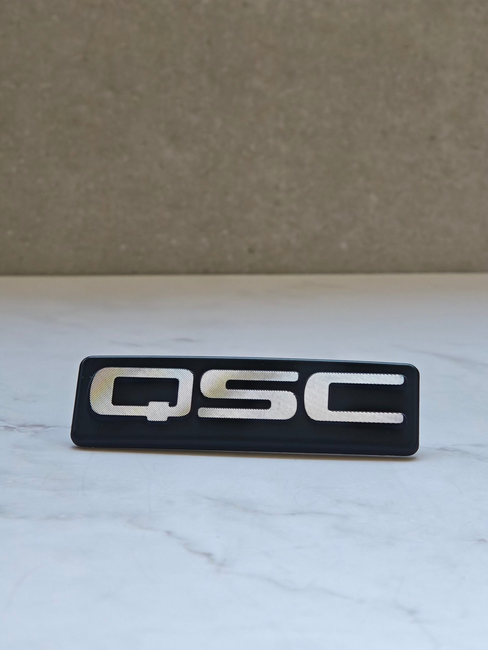 Custom diamond cut aluminum nameplate with 3D metal logo finish